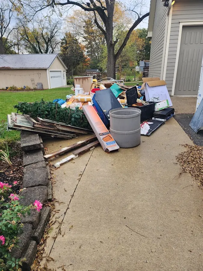 Dumpster being loaded with debris for 3 Yard Dumpster Rental in Idylwood